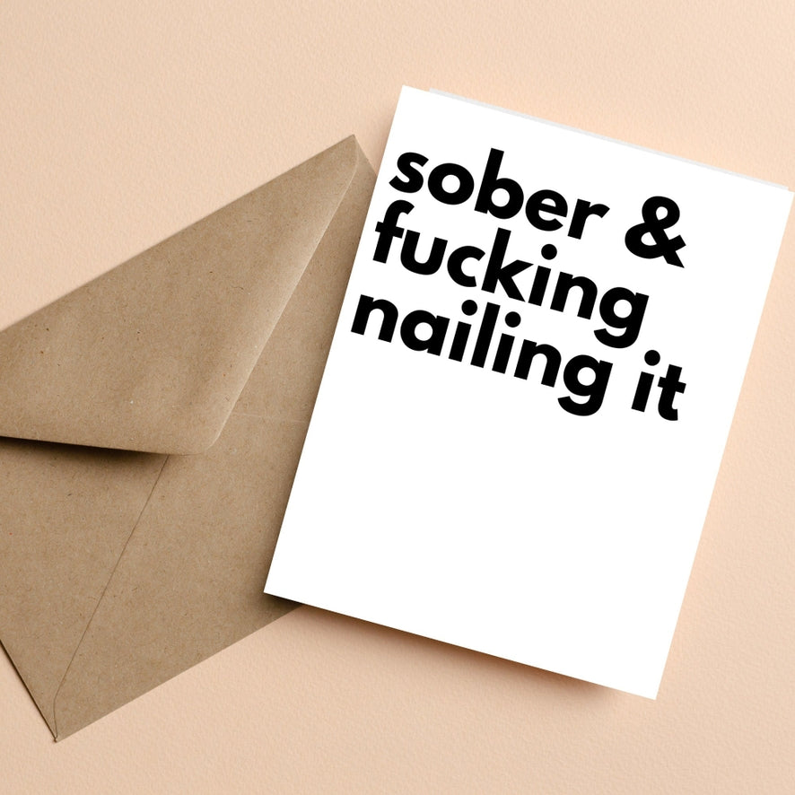 Greeting card: "Sober & fucking hailing it" bold black text on white