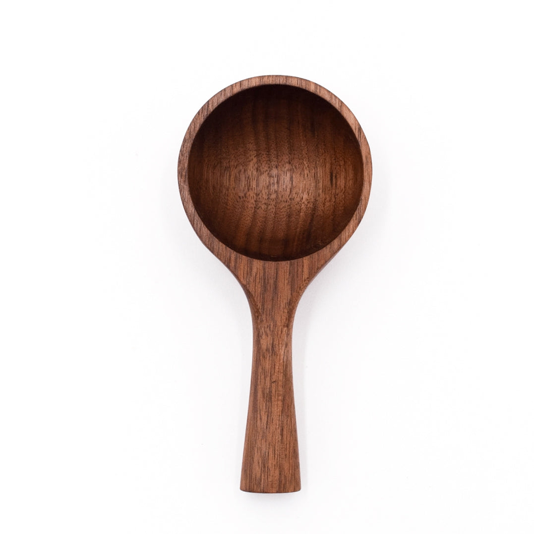 Large walnut wood serving scoop with wide round bowl and straight handle