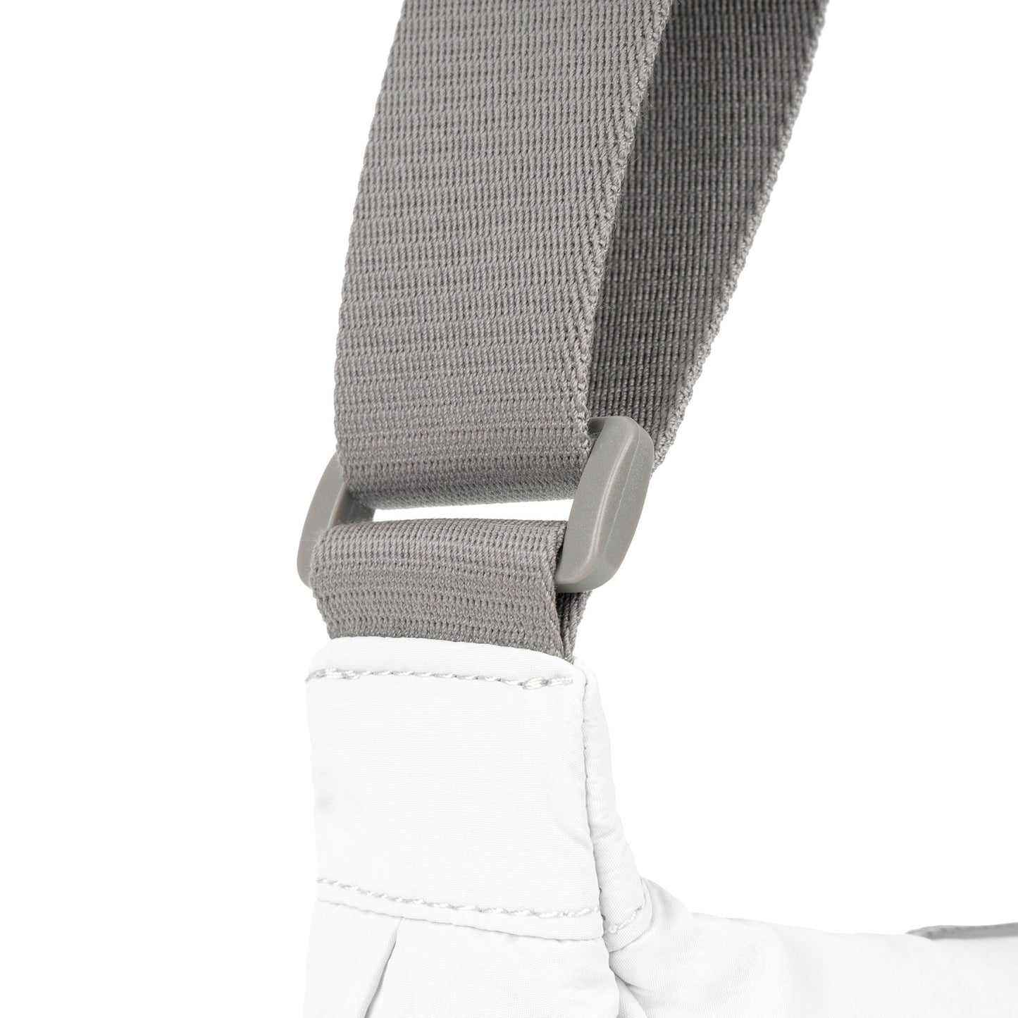 Coconut half-moon bag strap with gray webbing and stitched end attachment.