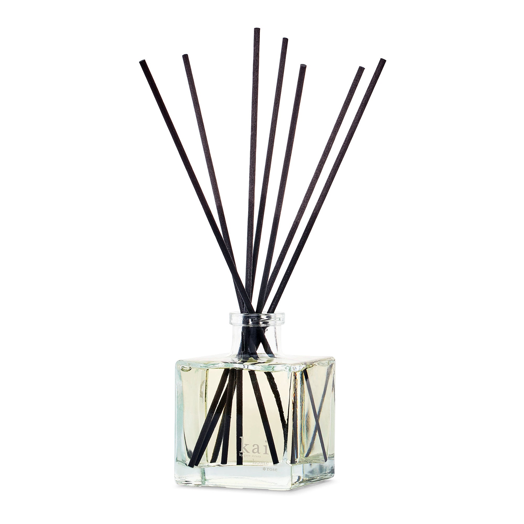 Square glass reed diffuser bottle with black reeds and clear liquid