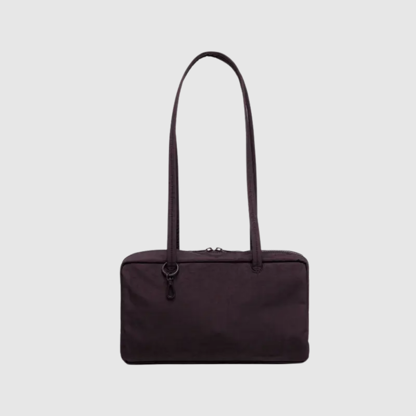 Nylon bowler bag in dark plum color with two top handles and zipper closure.
