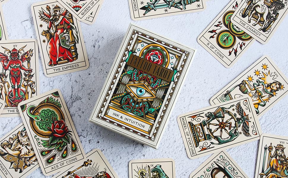 Tattoo tarot deck box with "Ink & Intuition" center card and scattered illustrated cards