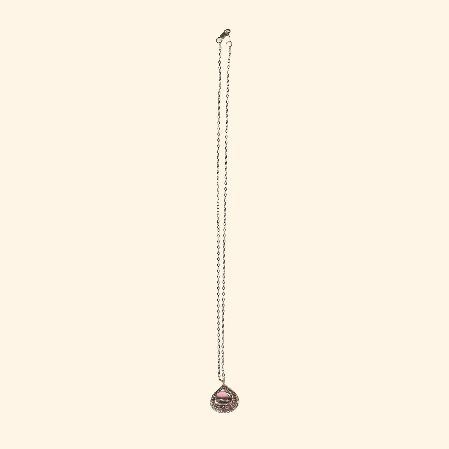 Amethyst pendant necklace with circular beadwork pendant on long silver chain