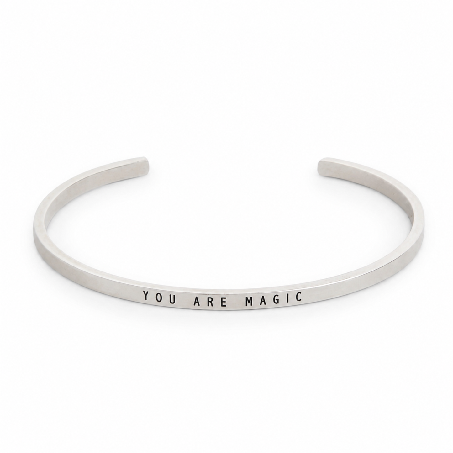 Narrow thin silver cuff bracelet stamped with “YOU ARE MAGIC”