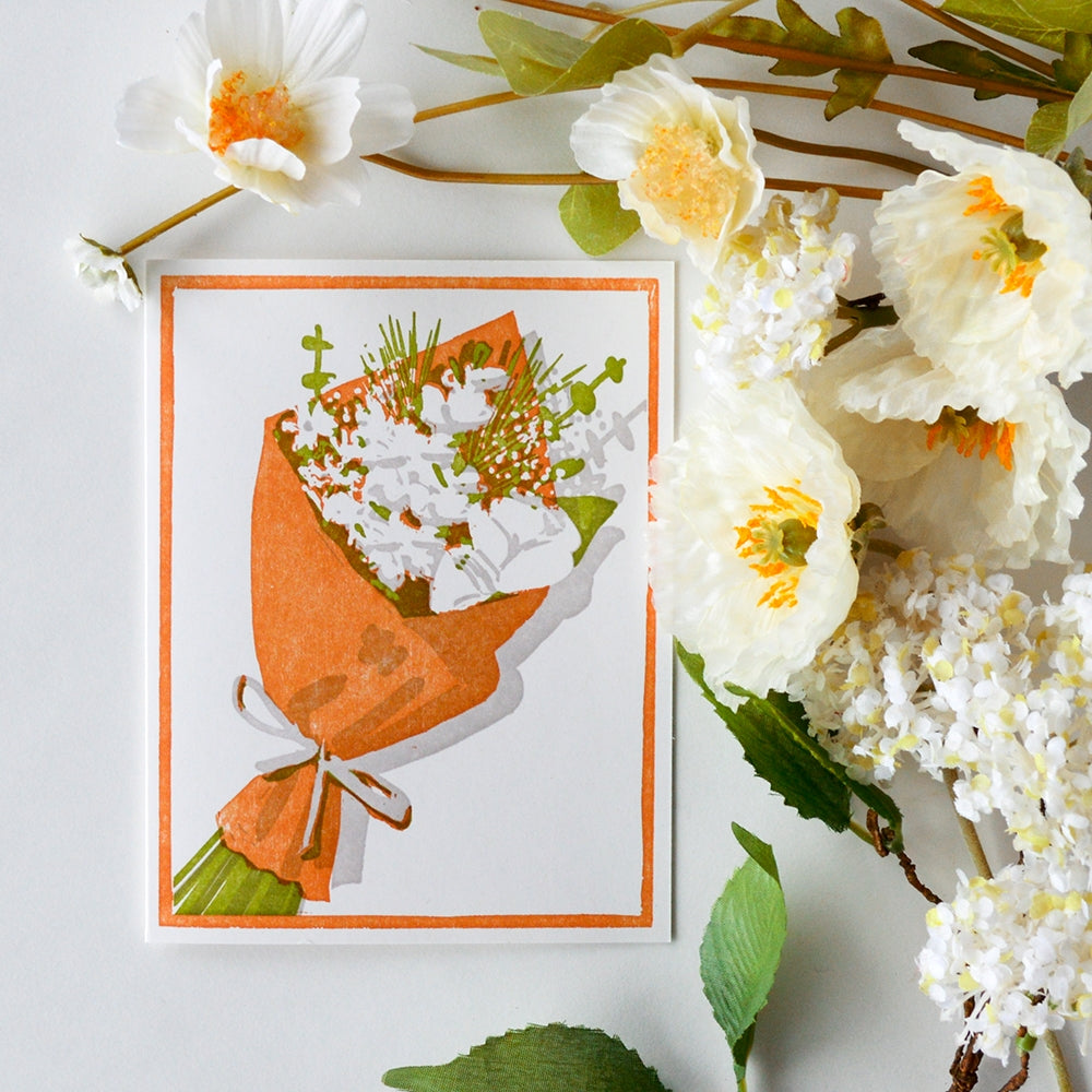 Greeting card front with orange border, bouquet illustration of white flowers and green stems
