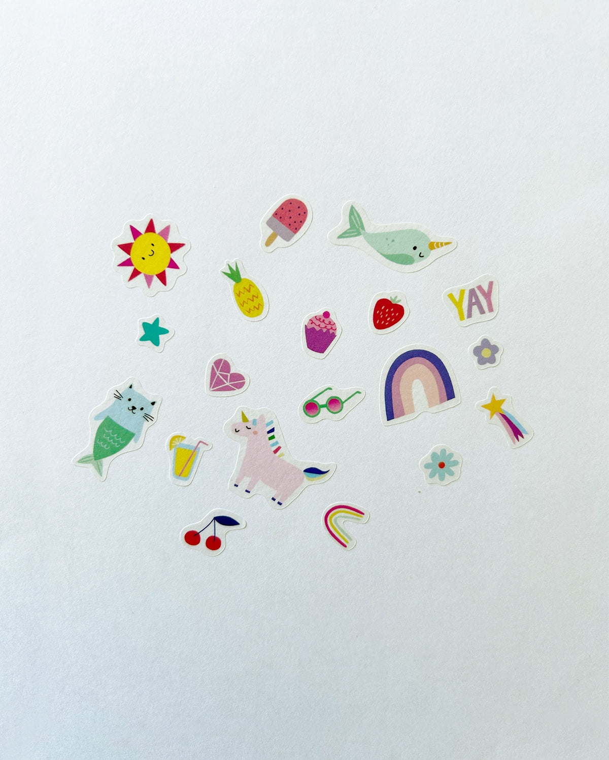 Sheet of colorful washi stickers with sun, fruit, whale, rainbow, and smiley icons
