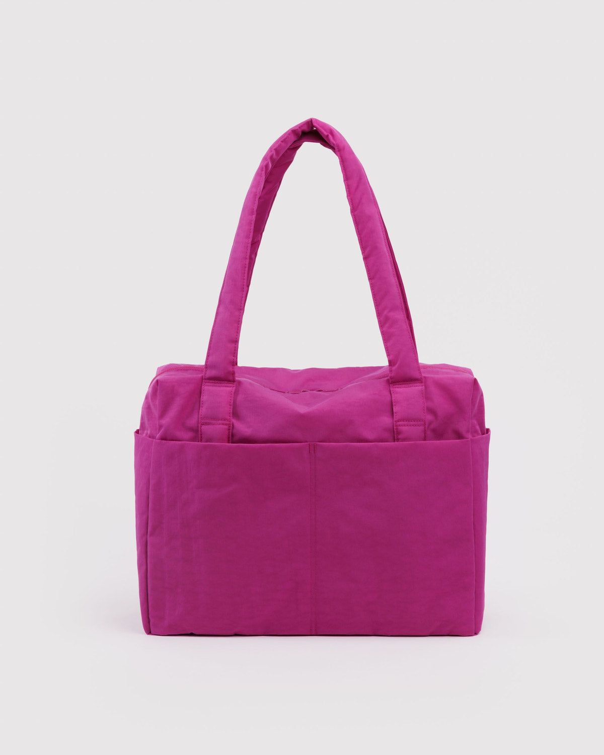 Bright pink carry-on tote bag with top handles and a structured front