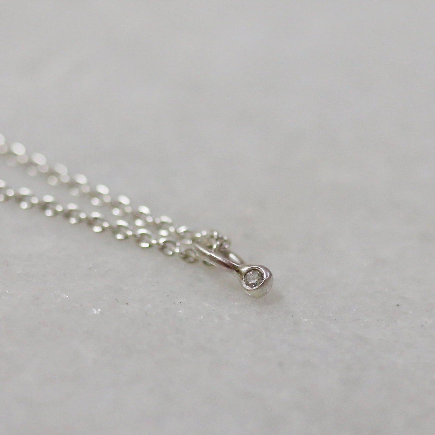 Sterling silver chain necklace with small diamond-fleck connector