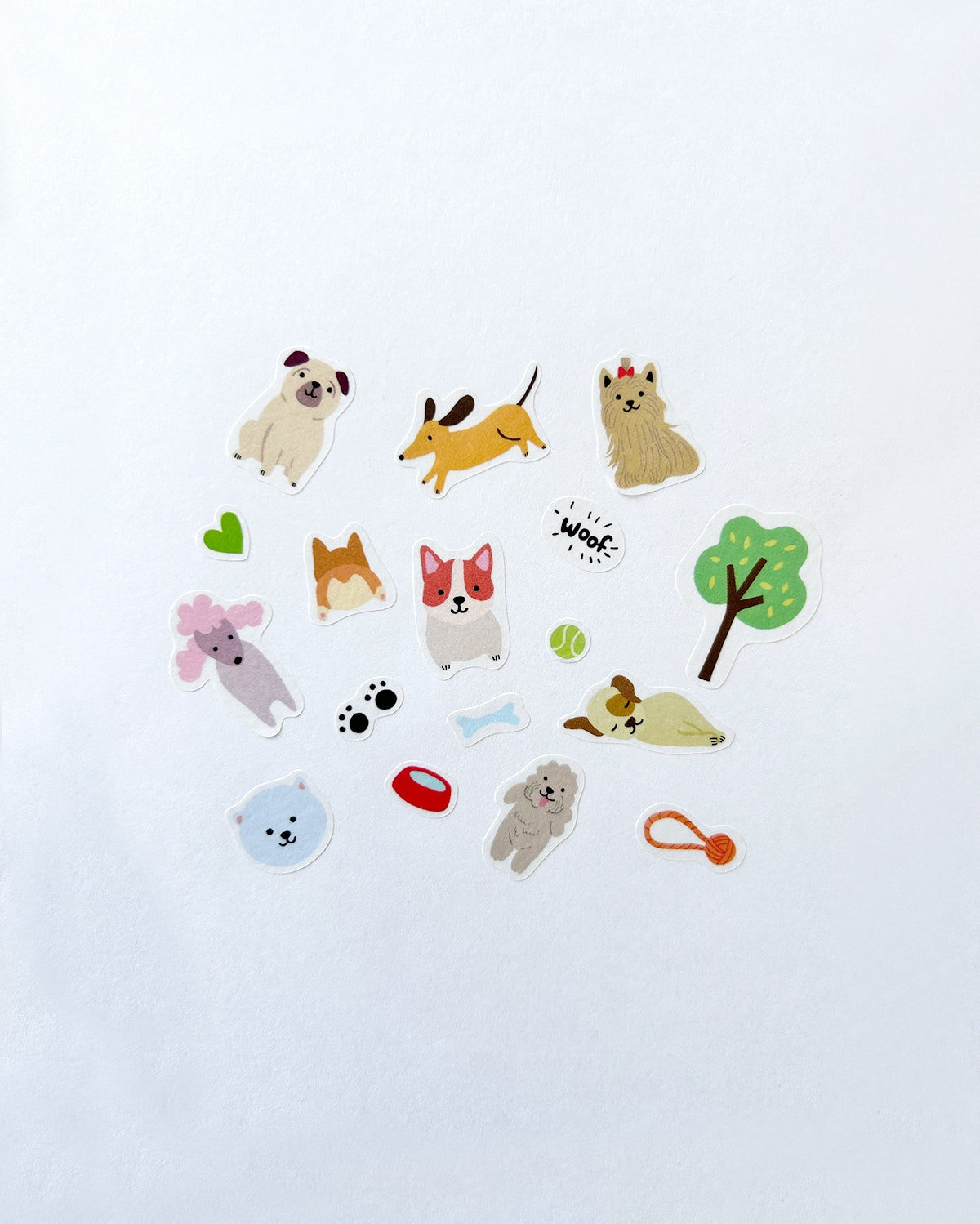 Assorted dog-themed washi stickers with paws, bones, leaves, and sleeping pups