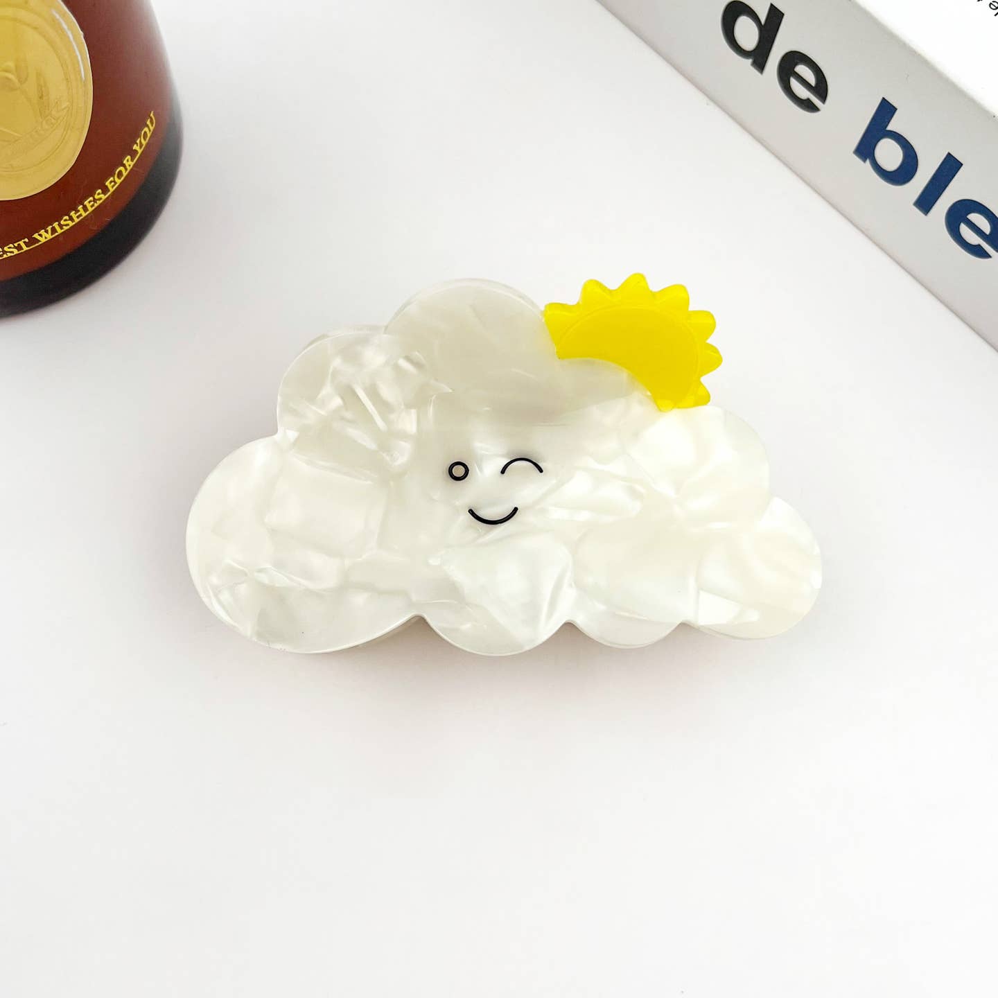 Cloud-shaped acetate hair clip with yellow flower and a smiling face