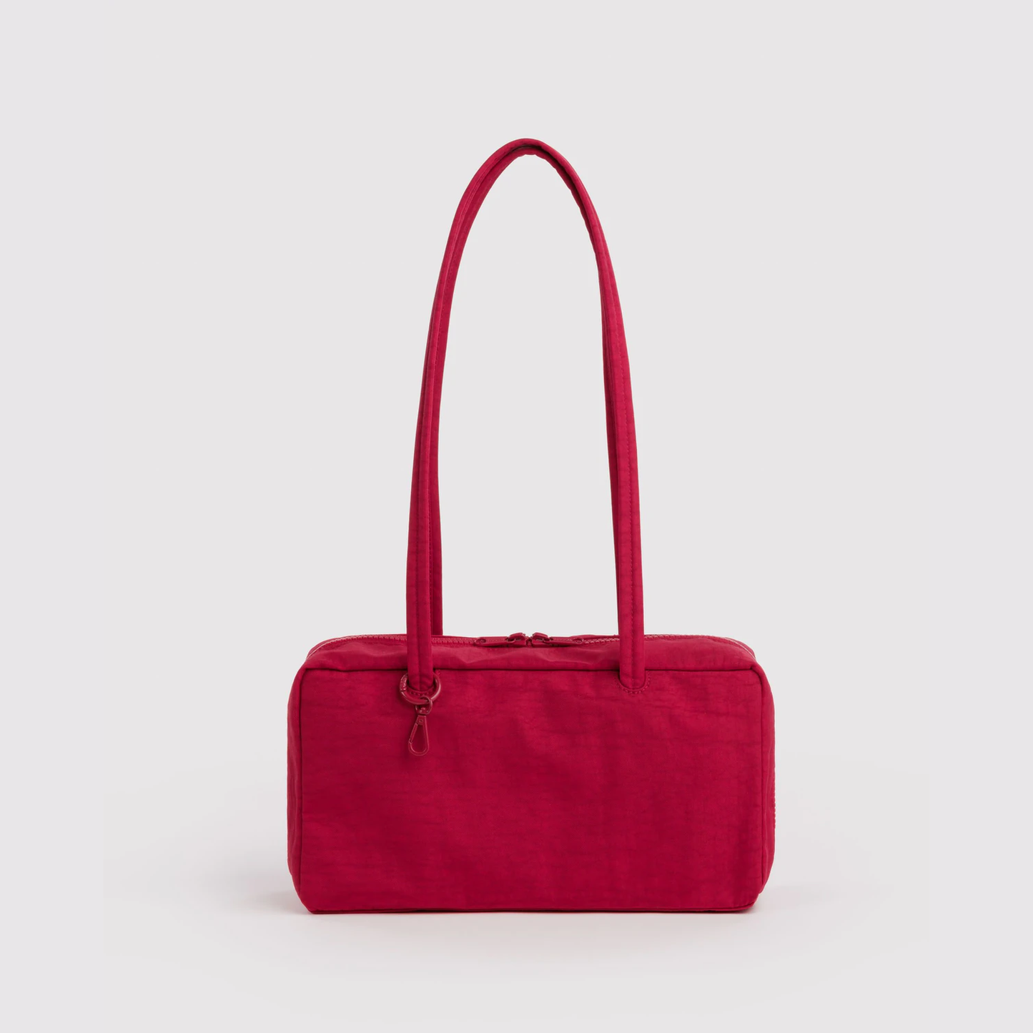 Red nylon bowler bag with top handles and zip closure