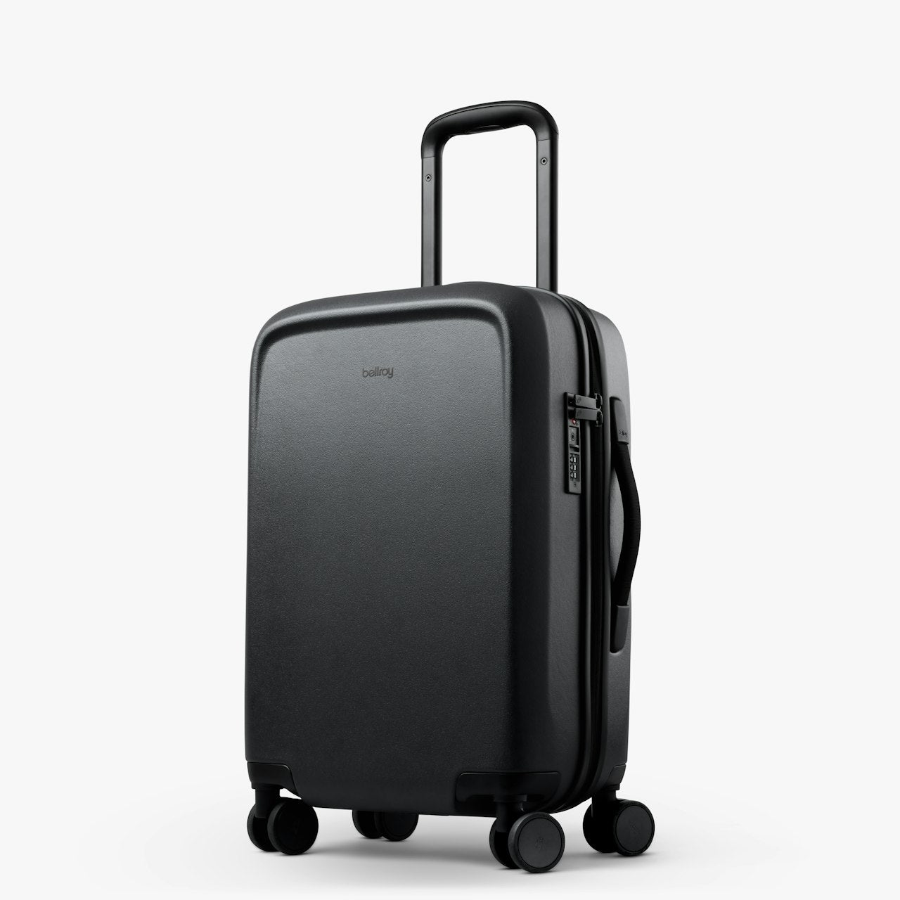 Black hard-shell carry-on suitcase with telescoping handle and four spinner wheels