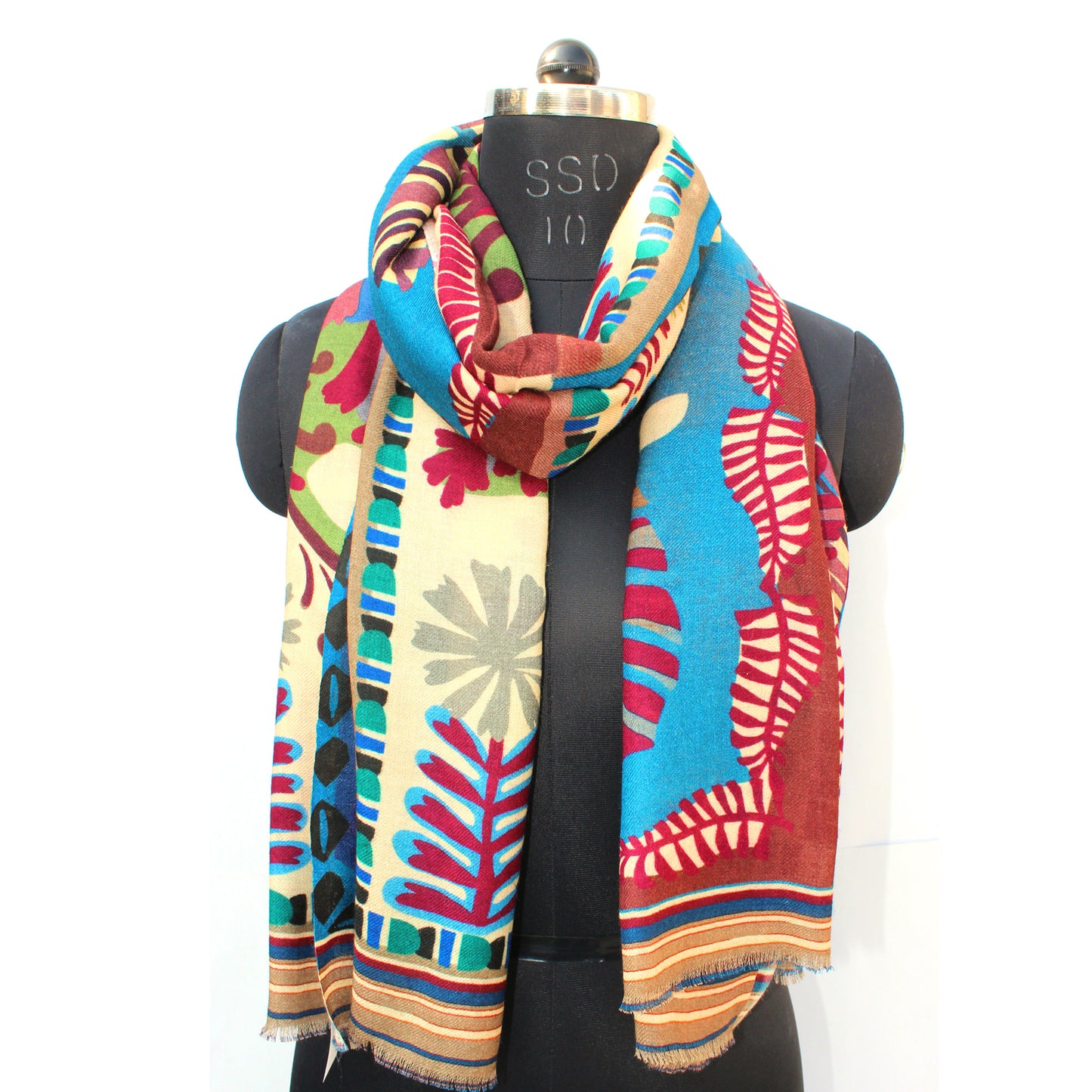 Wool kantha scarf on mannequin: blue and red floral stripe border with patchwork