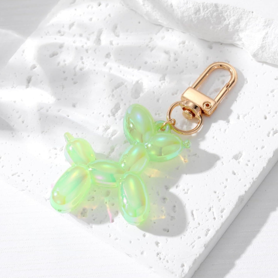 Light green metallic balloon dog keychain with gold clasp and split-ring attachment