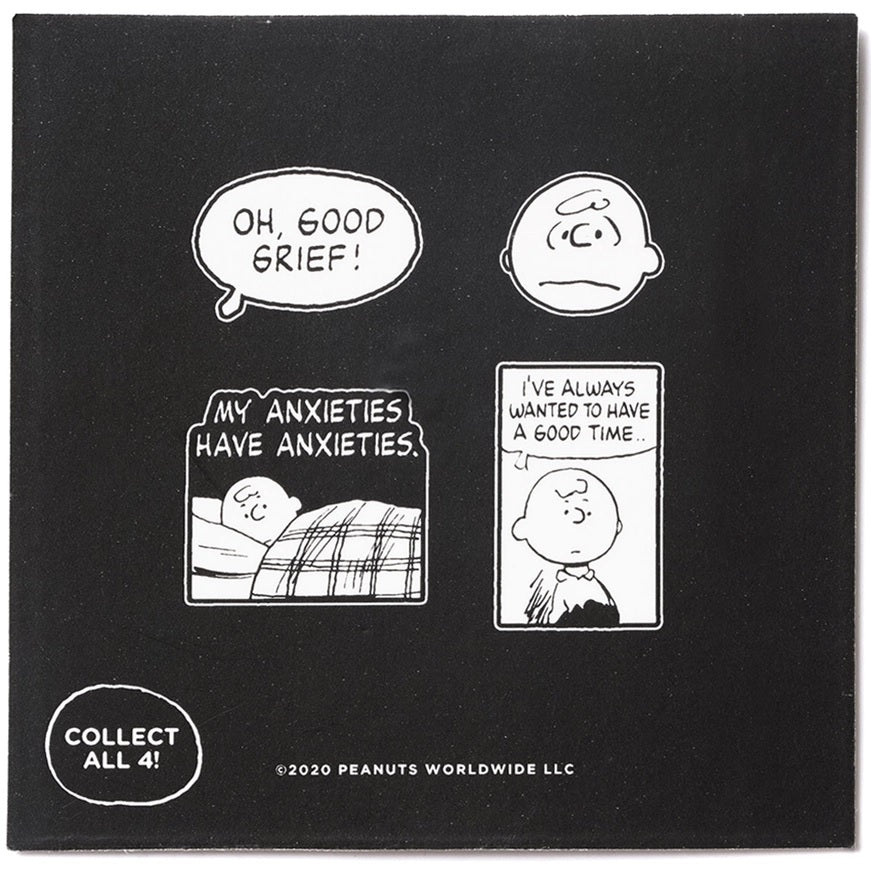 Peanuts pin backing card with four black-and-white comic panels and “collect all”