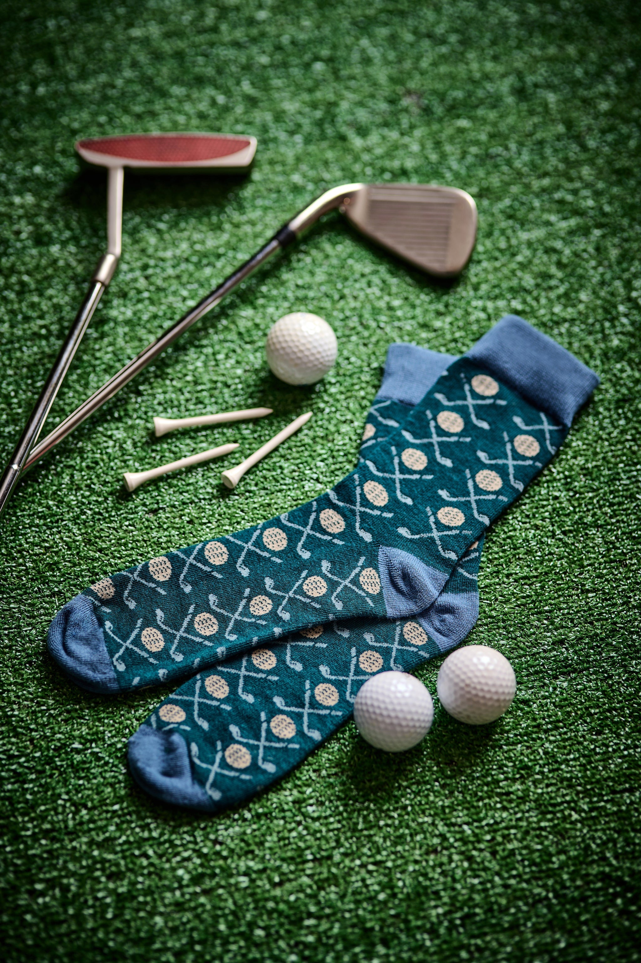 Golf-themed crew socks, dark teal with golf ball and club motifs