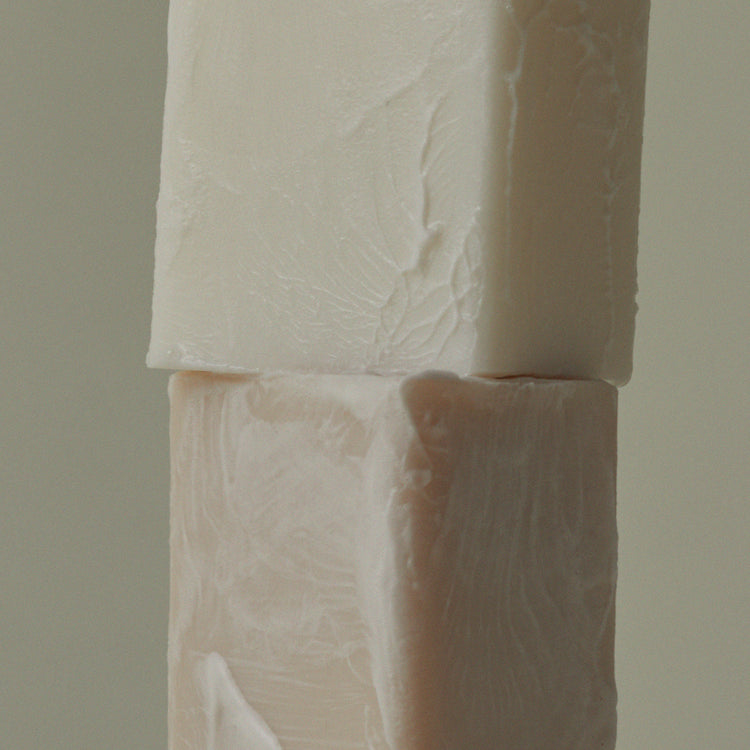 Mini soap bar close-up with embossed leaf texture on two stacked bars