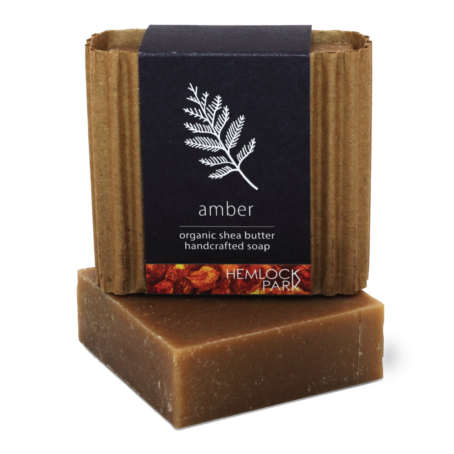 Amber organic shea butter soap bar, warm brown color with dark label wrap and paper sides