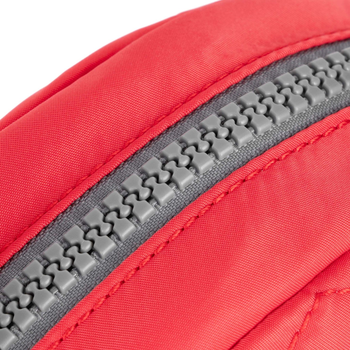 Red recycled canvas crossbody bag zipper with gray textured track close-up