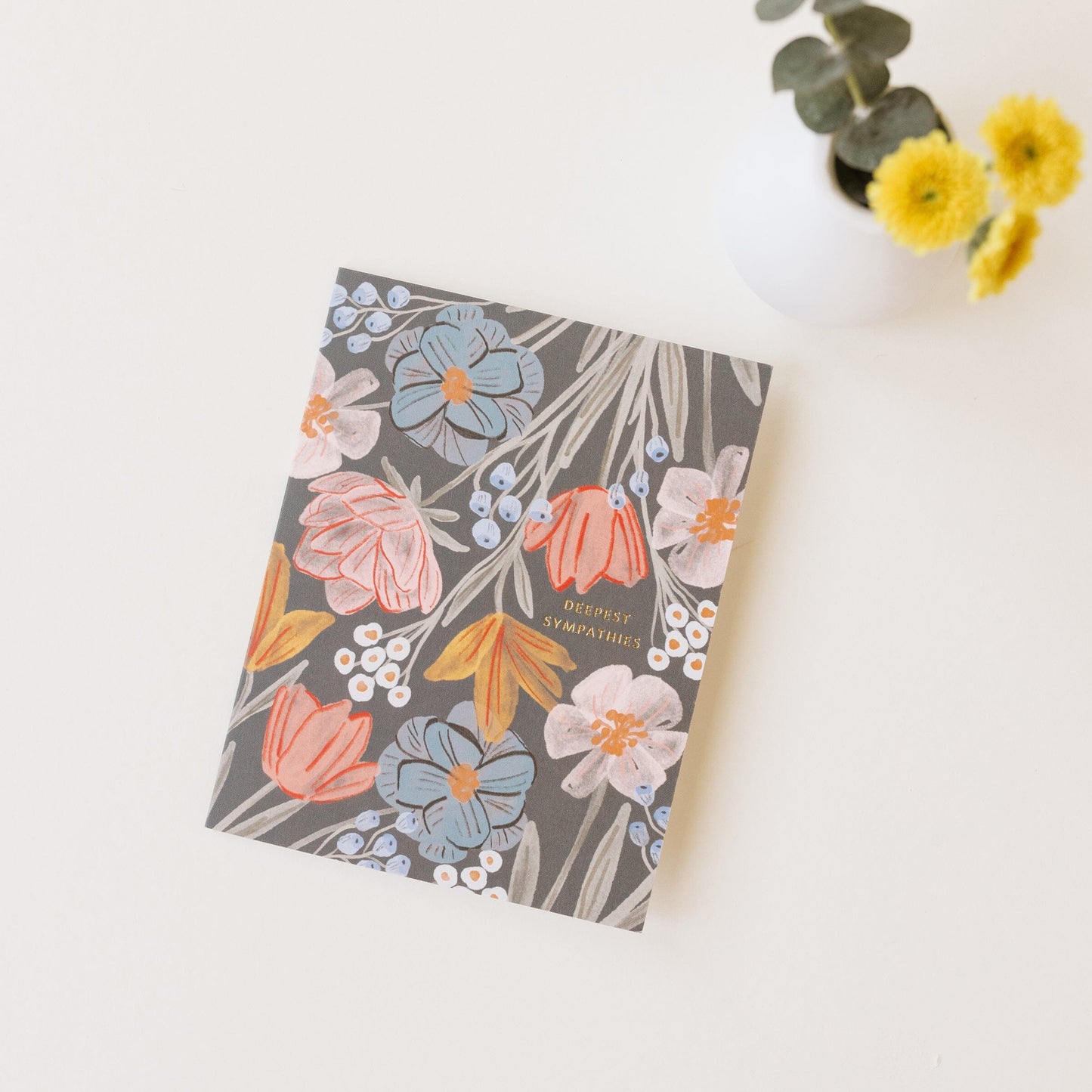 Sympathy greeting card with dark floral bouquet pattern of pastel flowers and leaves