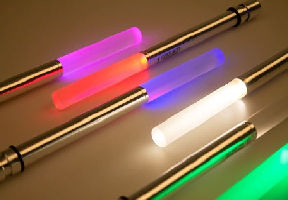 Multicolor LED bottle light wand rods glowing red, purple, green, and white