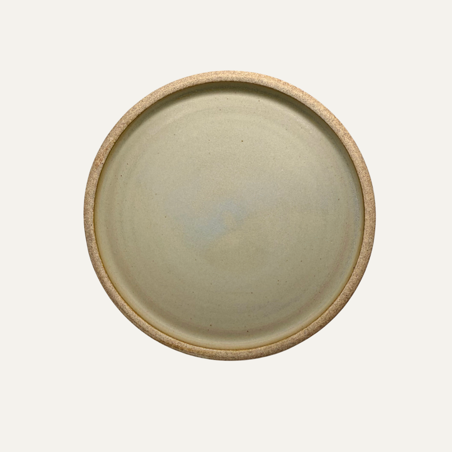 Cream matte glazed 8-inch plate, flat top with rounded rim and subtle speckling