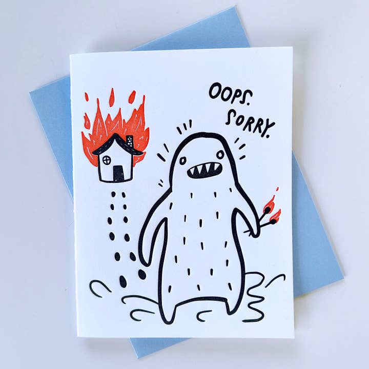 Everyday greeting card with cartoon monster, flames, and text reading “OOPS SORRY”