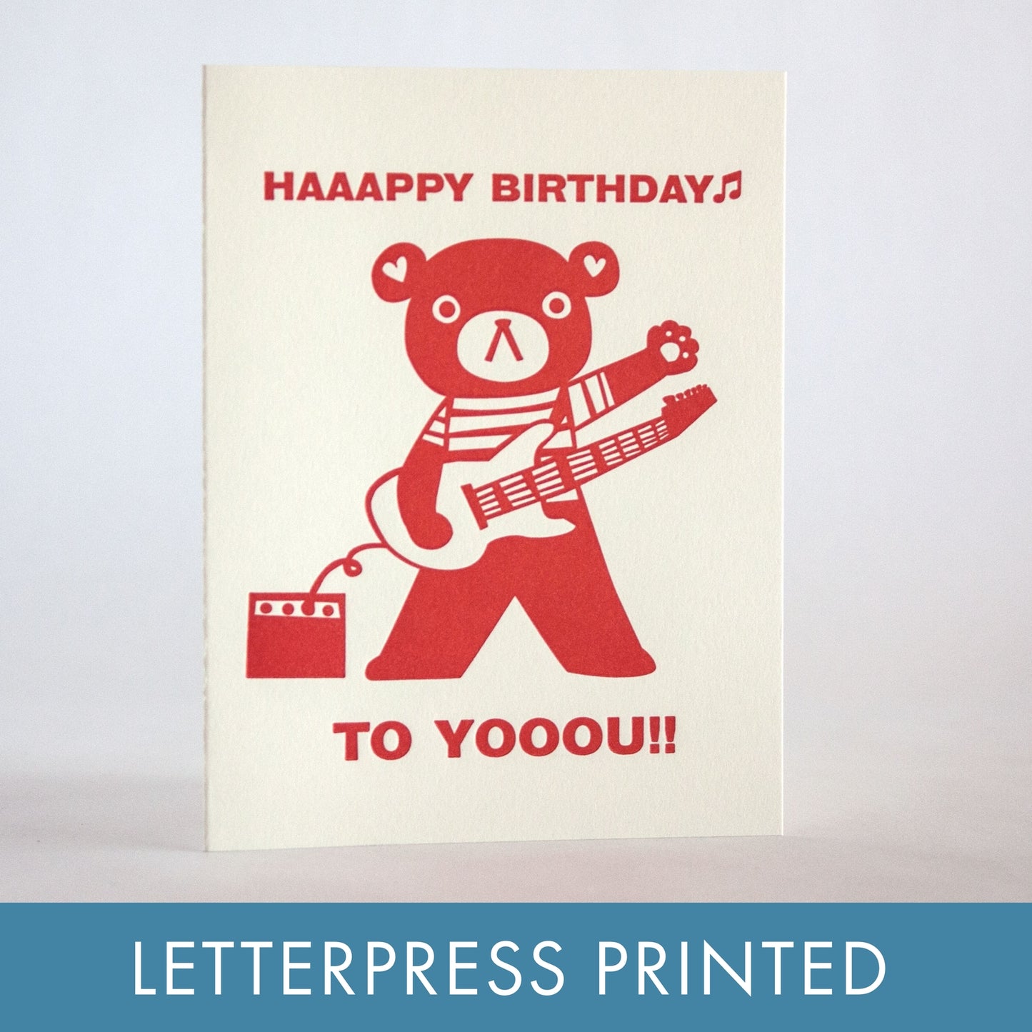 Letterpress birthday card, red bear with guitar and 'HAAAAPPY BIRTHDAY' text