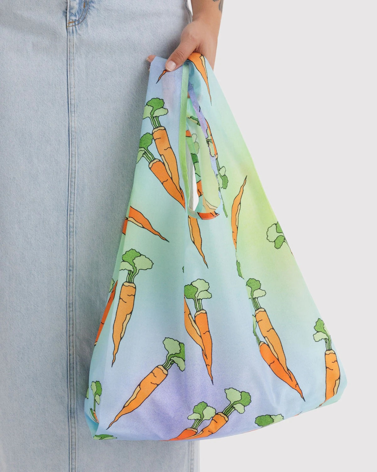Reusable tote bag with carrot pattern on light blue fabric