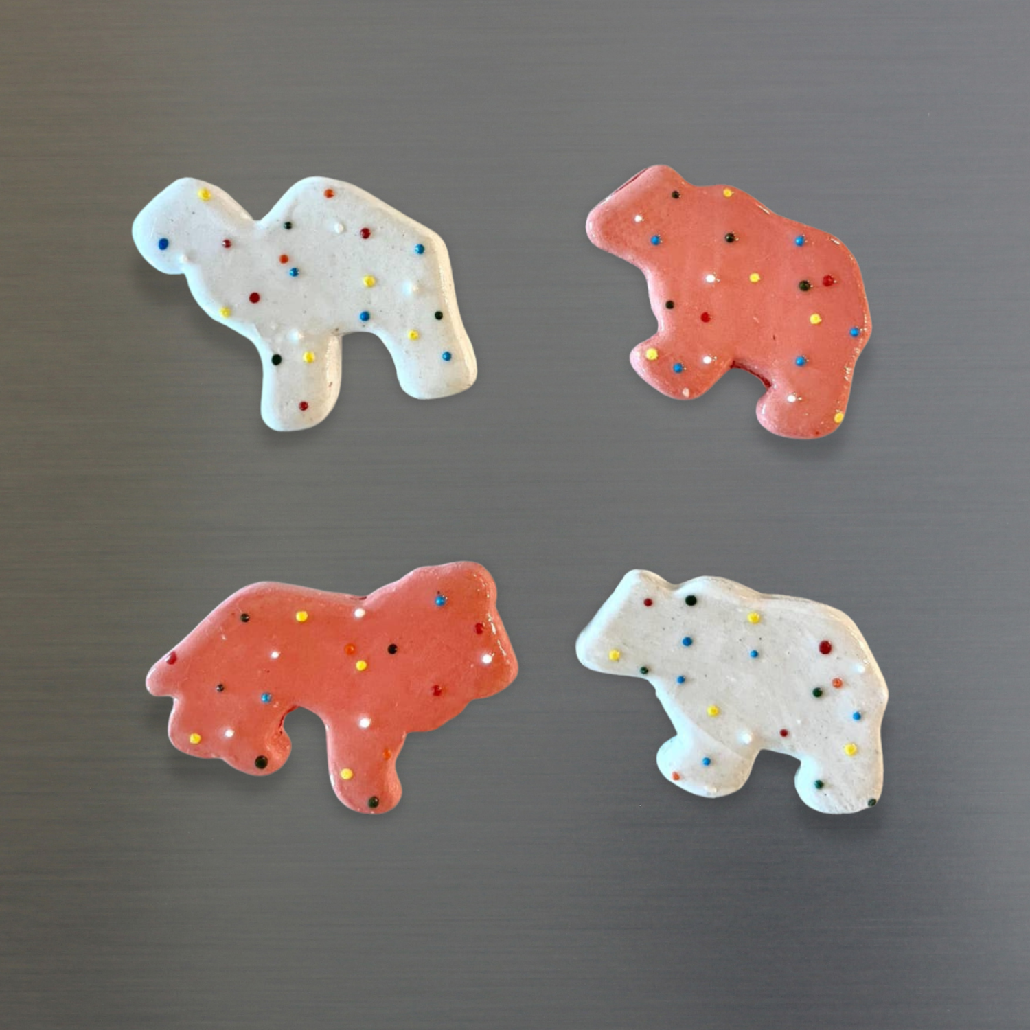 Animal cracker magnets set of 4 with pink and white frosted animal shapes