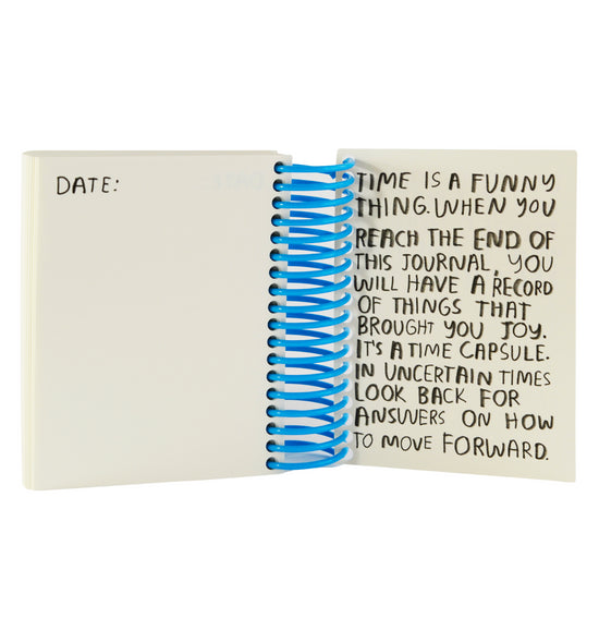 Journal interior page with blue spiral binding and motivational quote text