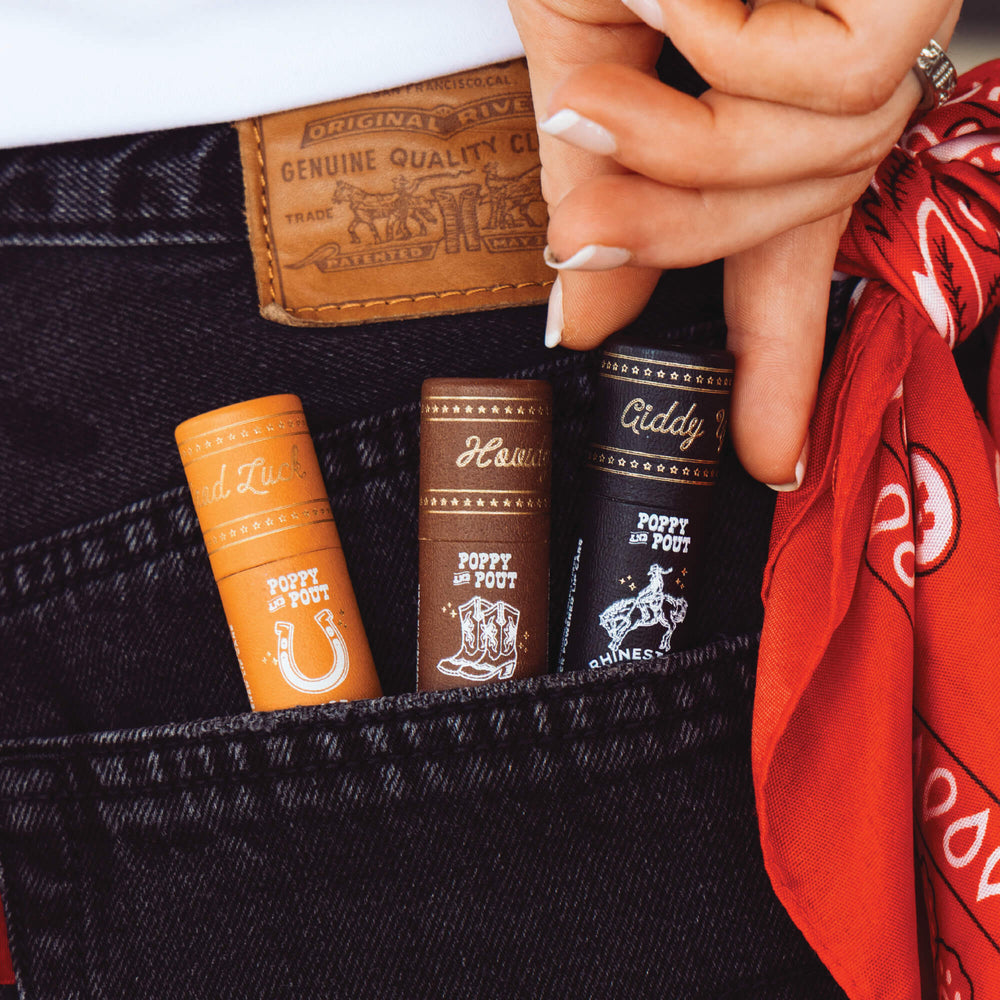 Lip balm tubes, multiple scents; small brown and orange tubes shown together