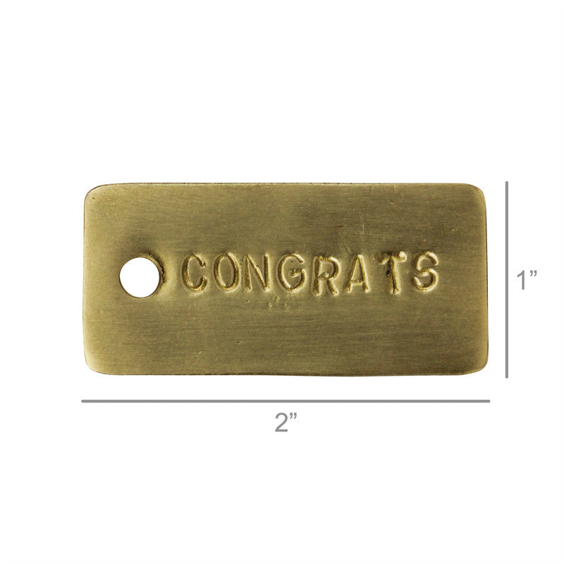 Brass gift tag reading CONGRATS, 2in x 1in rectangle with hole