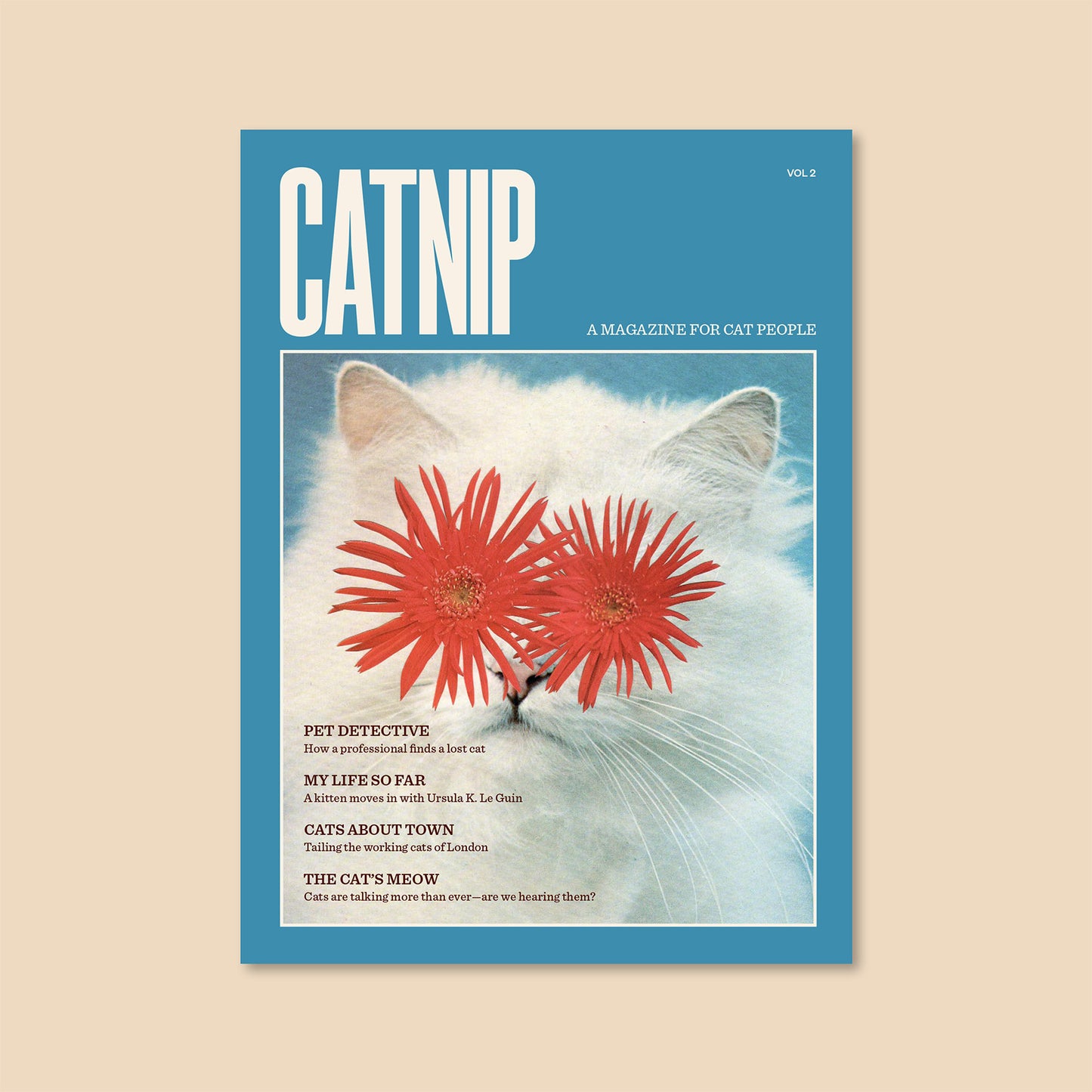 Cat magazine cover in blue with CATNIP VOL 2 title and cat-themed artwork