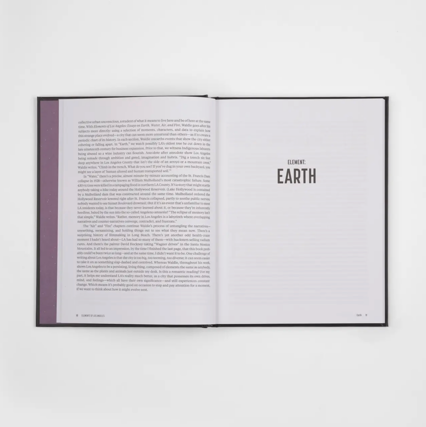 Open interior pages with 'EARTH' section title and paragraphs of text on right