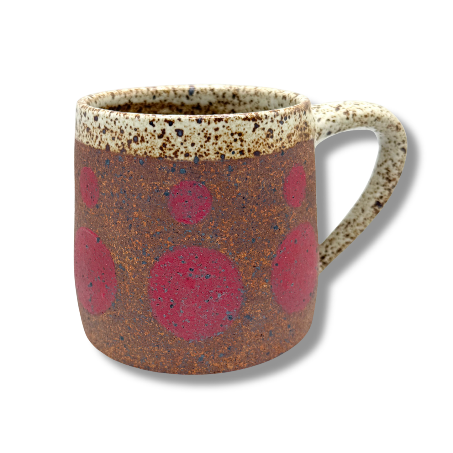 Ceramic mug, speckled cream rim and handle, brown with red circle print