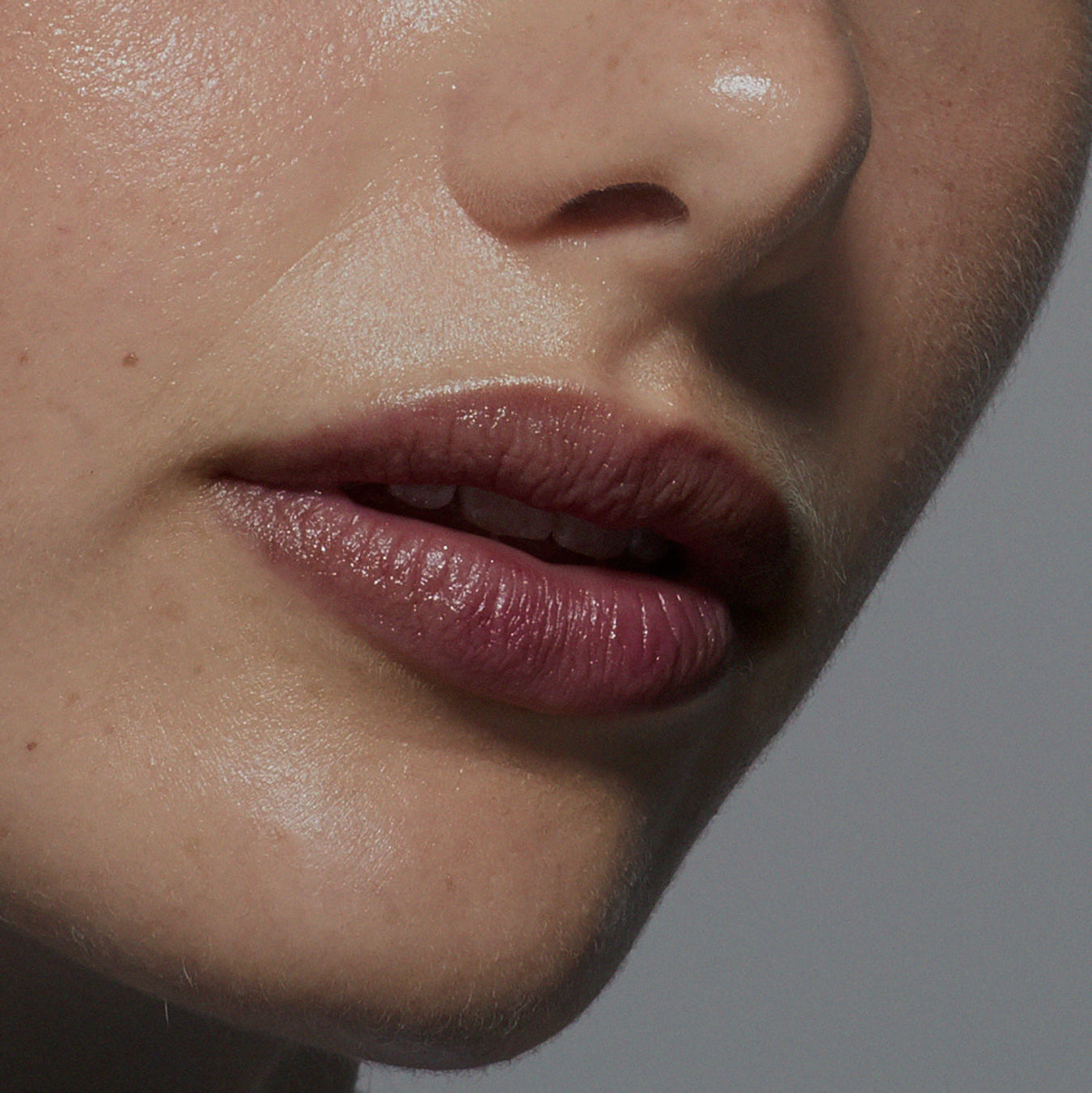 Tint Me Lip Punch lip balm, berry glossy lips close-up