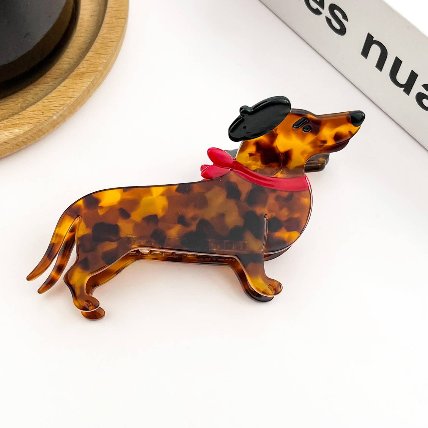 Tortoiseshell dog hair claw clip with red bow scarf detail