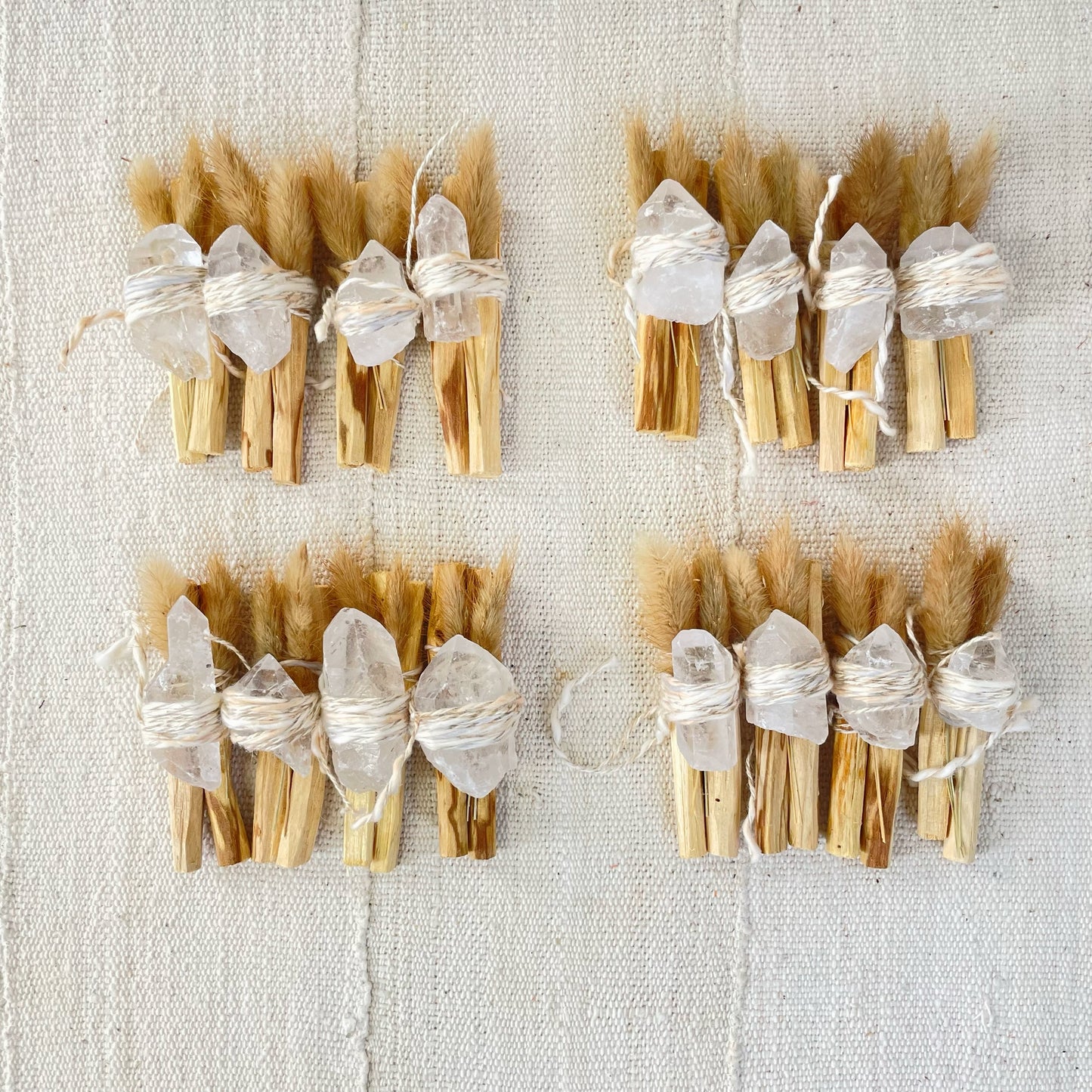 Palo santo bundle with clear crystal points, bundled sticks tied with twine