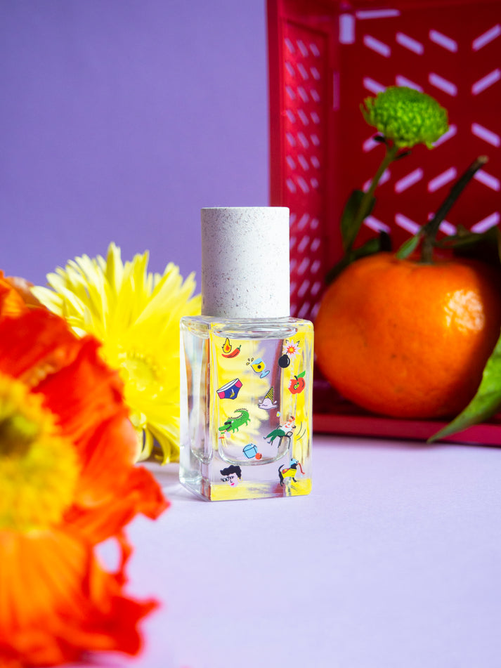 Poom Poom eau de parfum bottle, clear glass with playful animal print and silver cap