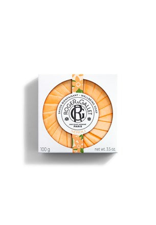 Neroli wellbeing soap in orange round bar with Roger&Gallet logo on label