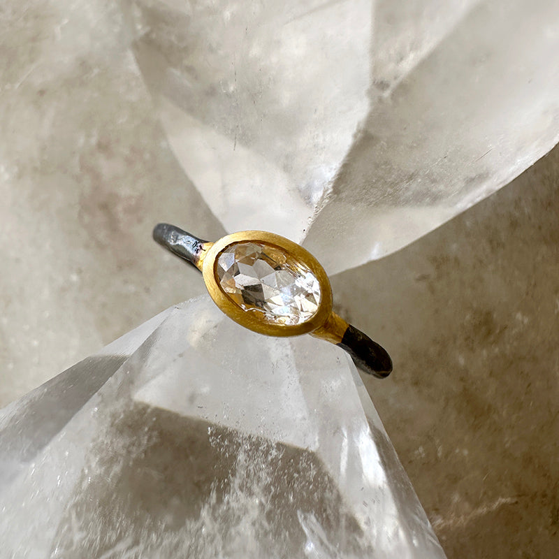 Morganite gemstone ring with oval stone in gold vermeil bezel on oxidized silver band