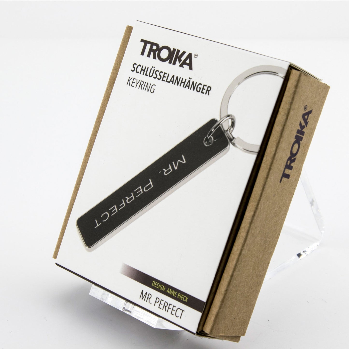 Mr. Perfect keychain packaging with black enamel bar charm and chrome ring