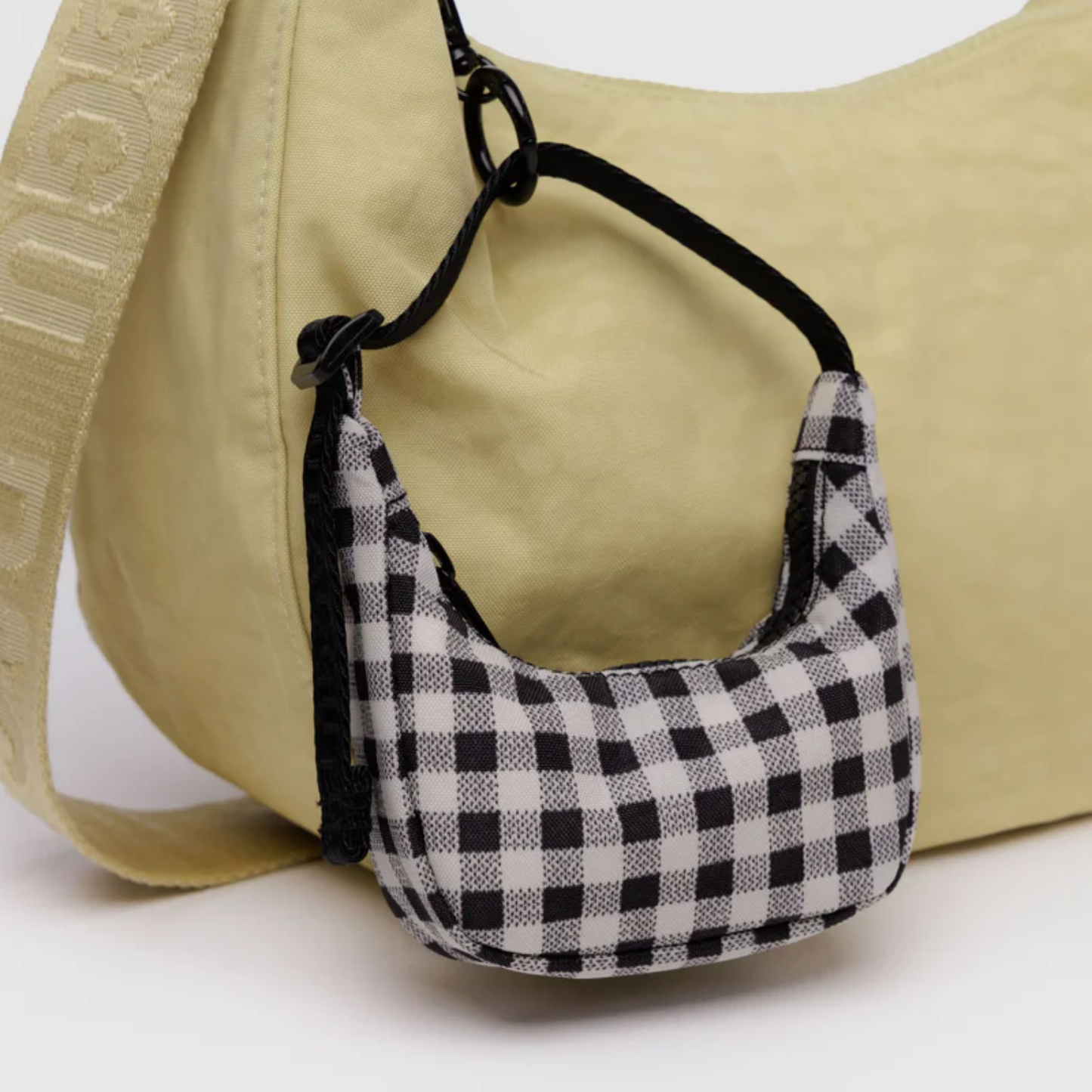 Black and white gingham crescent bag charm with black drawstring loops