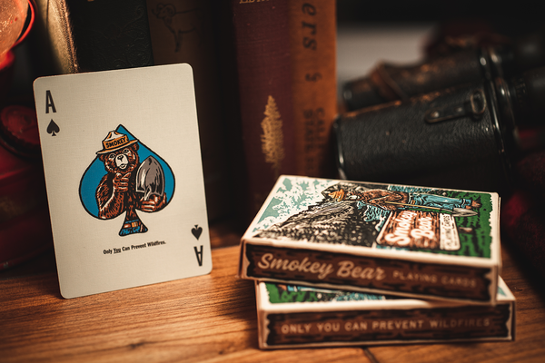 Smokey Bear playing cards showing Ace of spades and deck with wildfires theme