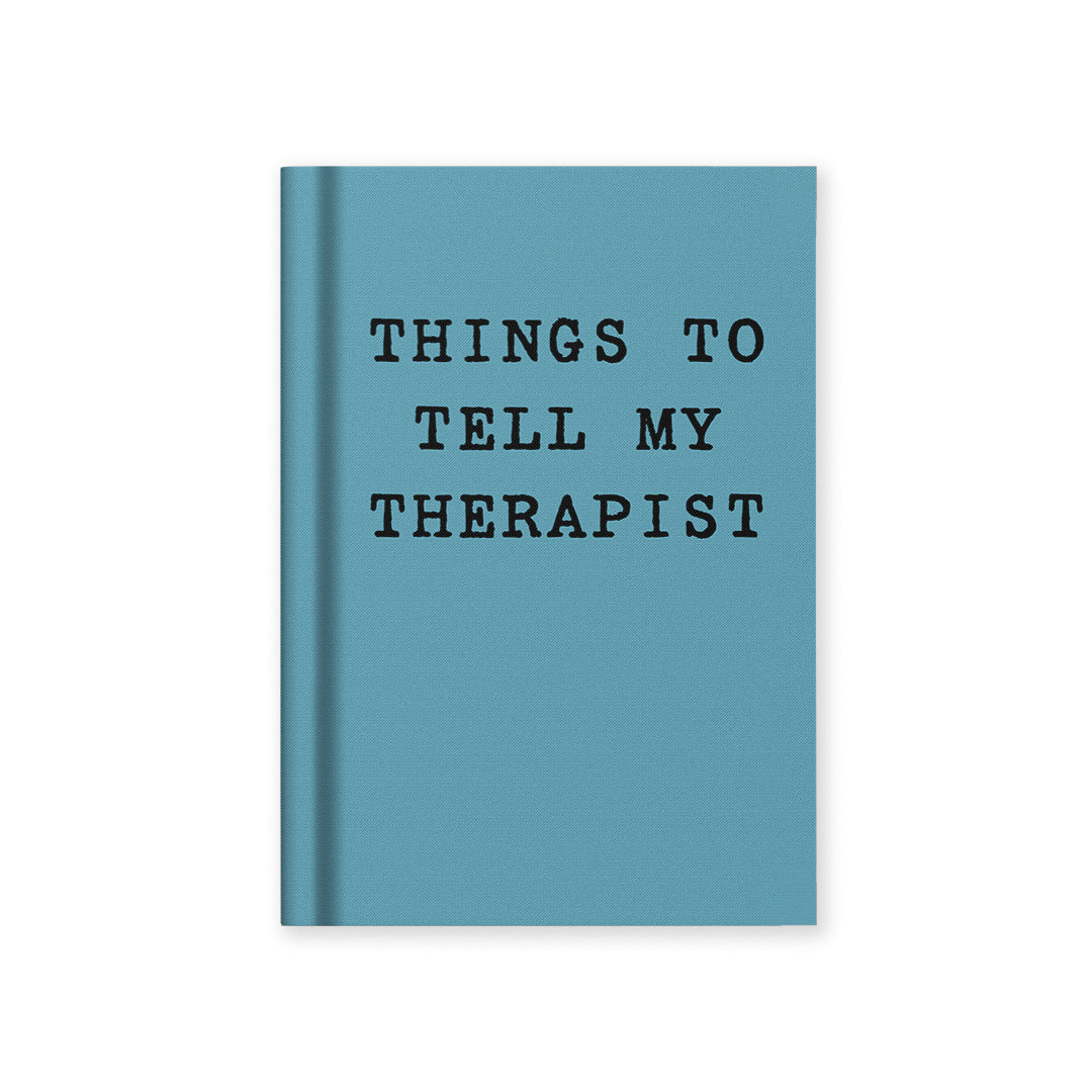 Teal fabric hardback notebook with black title text on cover