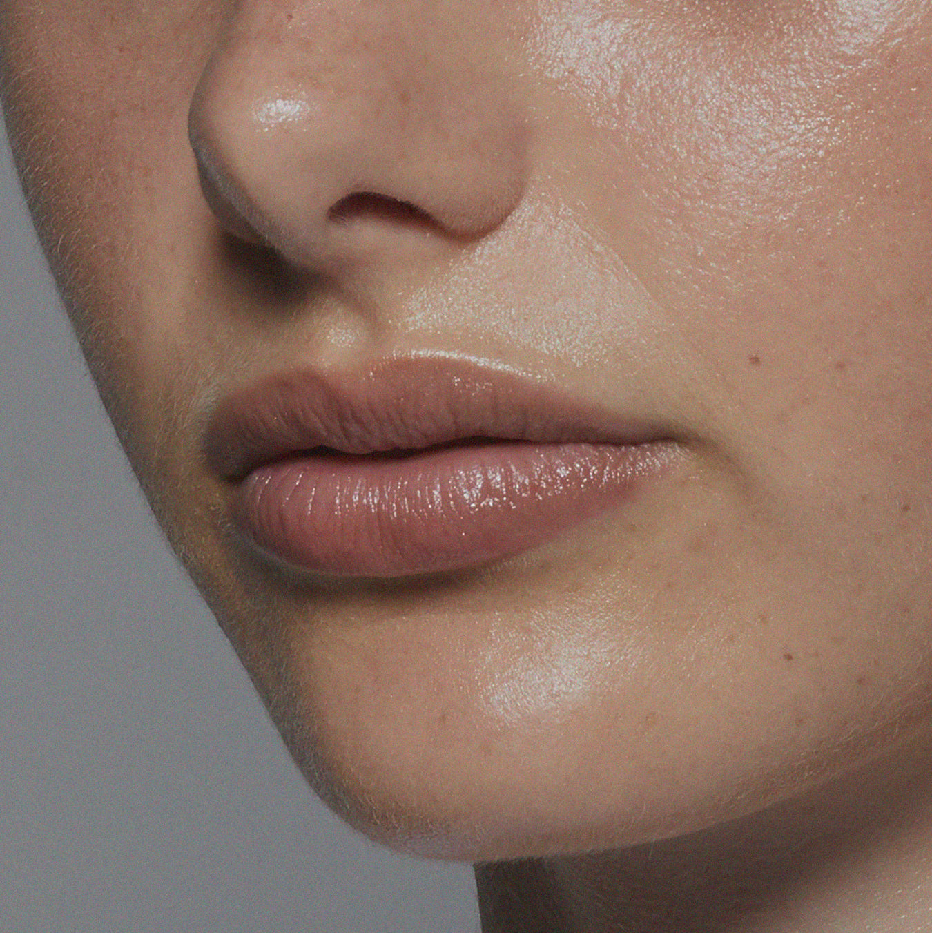 Tint Me Lip Punch lip balm, mauve glossy lips close-up