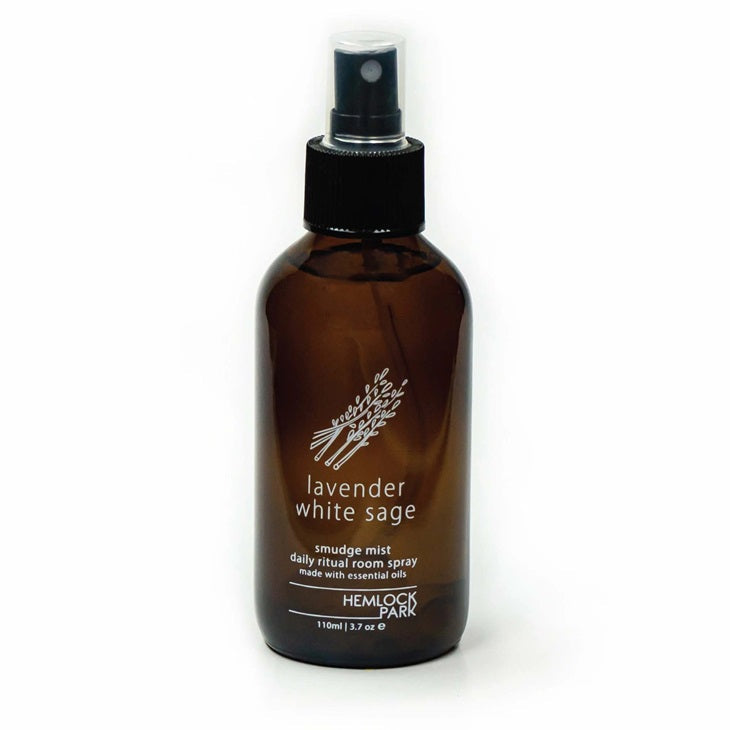 Lavender & white sage smudge spray in amber bottle with black pump sprayer