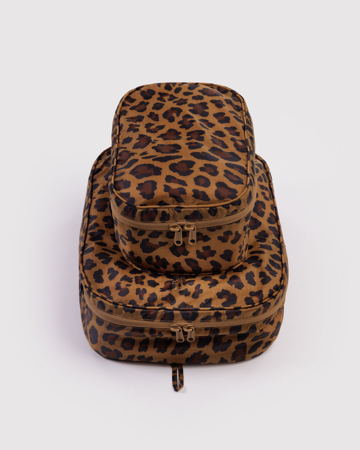 Packing cube set in leopard print with multiple zip compartments