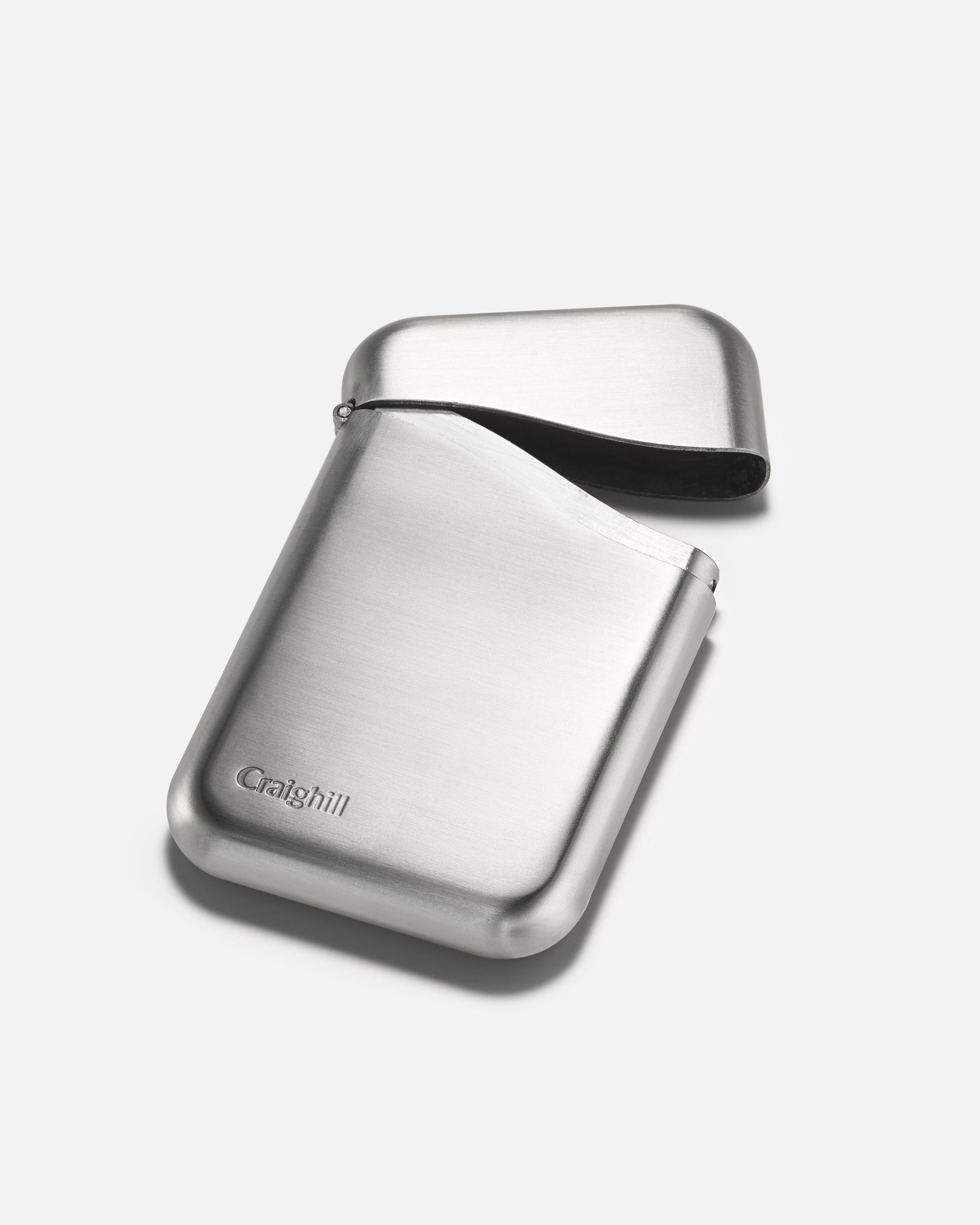 Stainless steel card case with hinged cover and black accent, closed, rounded edges.